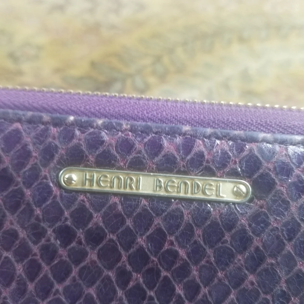 Henri Bendel purple snakeskin embossed leather wallet